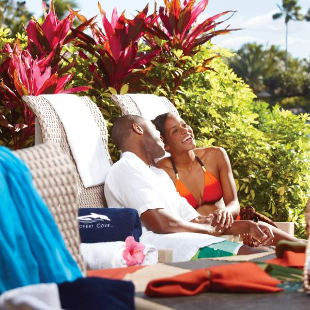 Discovery Cove couple relaxing at cabana