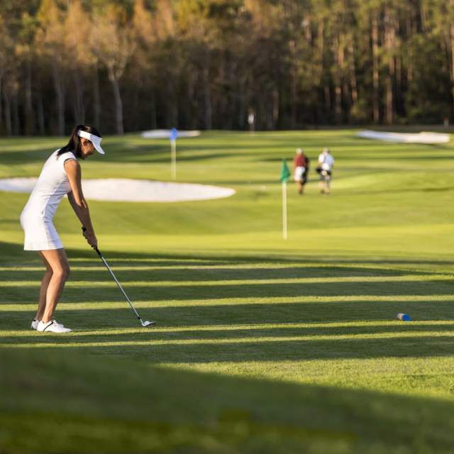 Women golfing at Tranquilo Golf Club at Four Seasons Resort Orlando short course