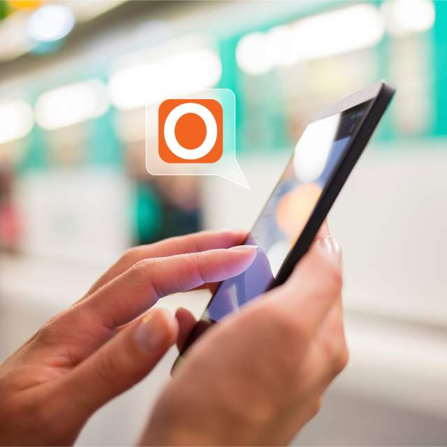 Hands holding and manipulating a phone with the Visit Orlando App.