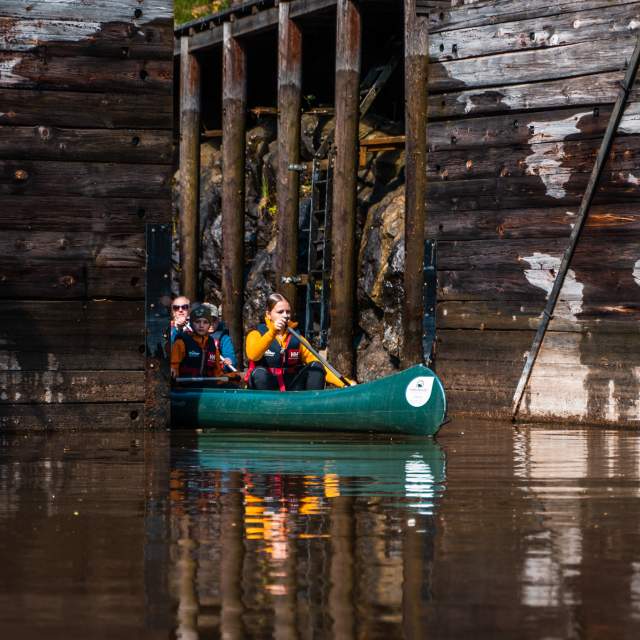 Canoeists paddle out of lock chambers.