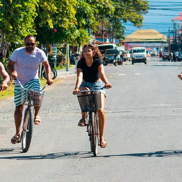 Group biking on the streets of Colon Island, Bocas del Toro