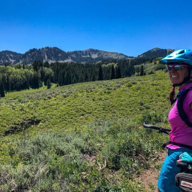 Mountain Bike Instructor with scenic view behind her