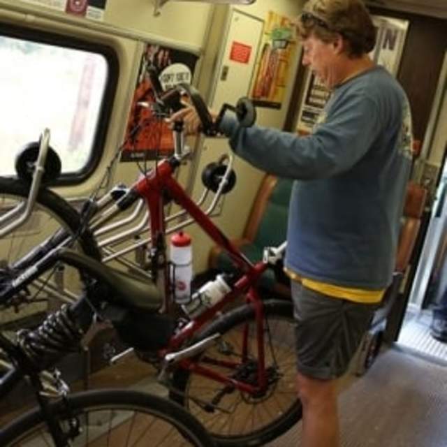 man on train with bike