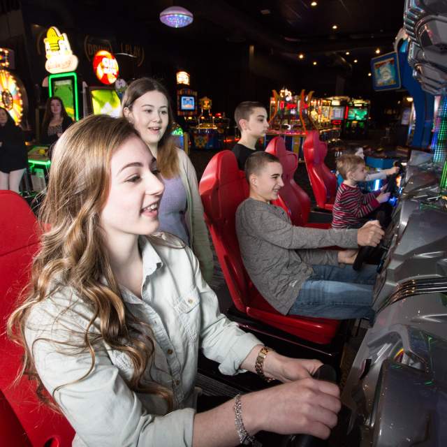 Kids Playing Arcade Game at Dave & Buster’s in Providence, RI