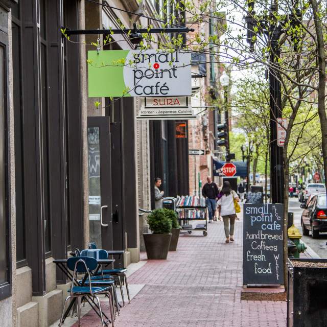 Shoppers stroll past popular boutiques on Westminster Street in Providence