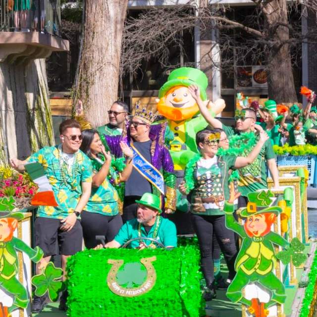 Parade float decorated in green decor for St. Patrick's Day