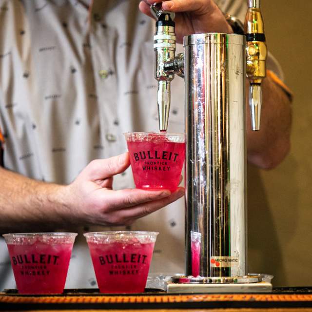 Man serving Bulleit Frontier Whiskey