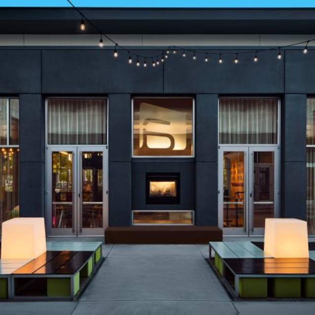 String lights at nighttime in the courtyard at Aloft San Francisco Airport