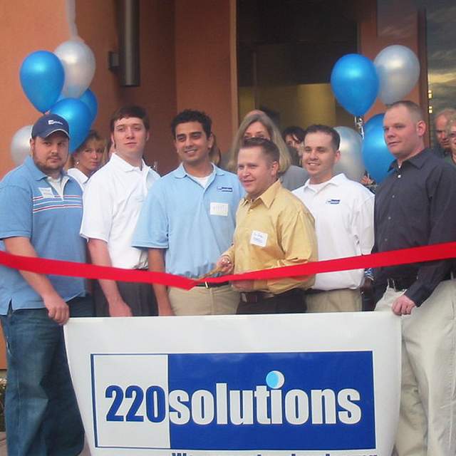 Ribbon cutting ceremony for 220 Solutions