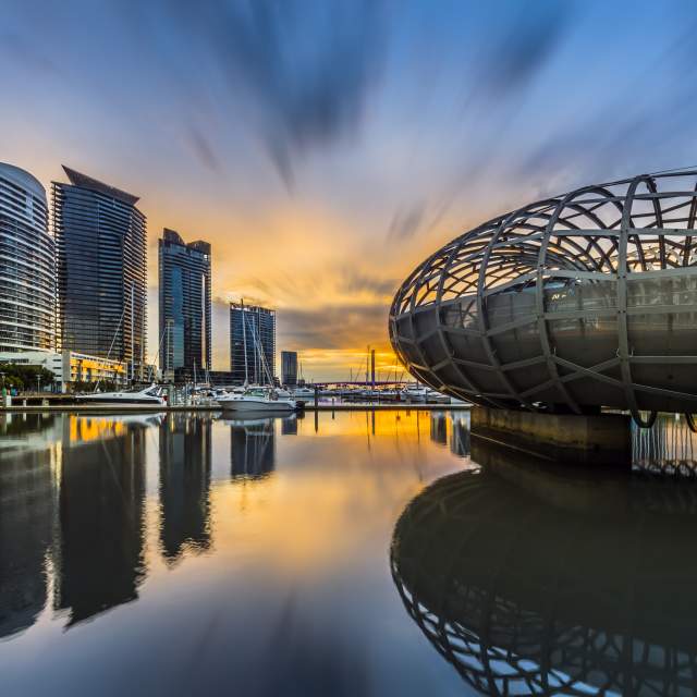 A few of buildings along the water in downtown Melbourne.