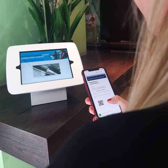 person using check-in kiosk