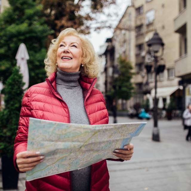 Solo Travel - Woman traveling solo with a map