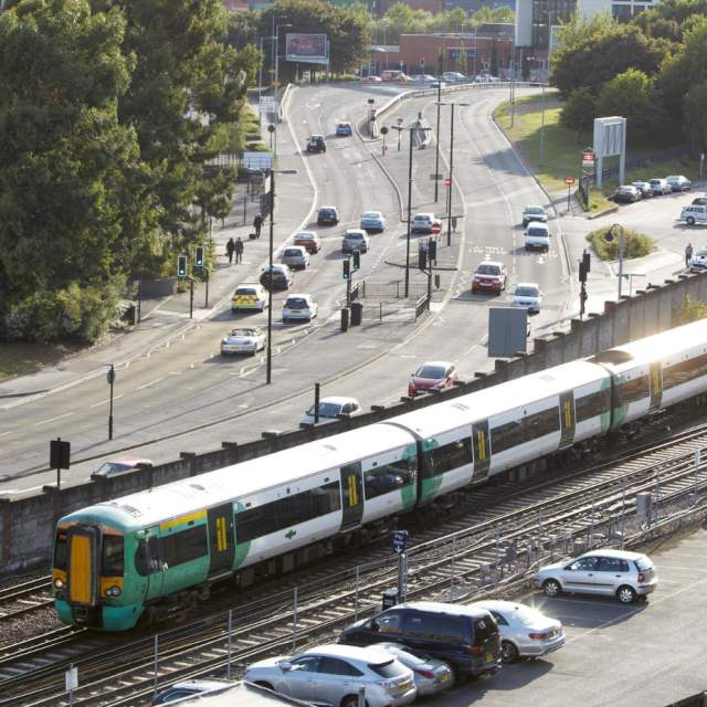 Birds eye view of train pulling out of Southampton Central Train station