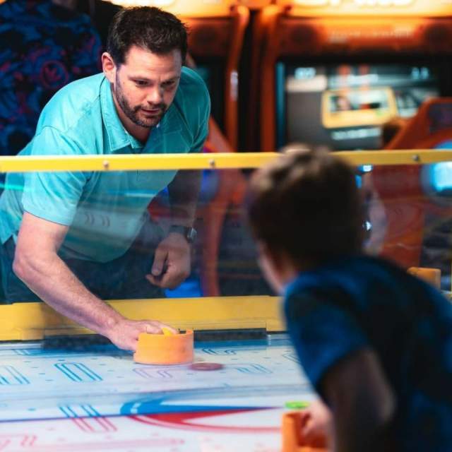 Dad Playing High Score Arcade