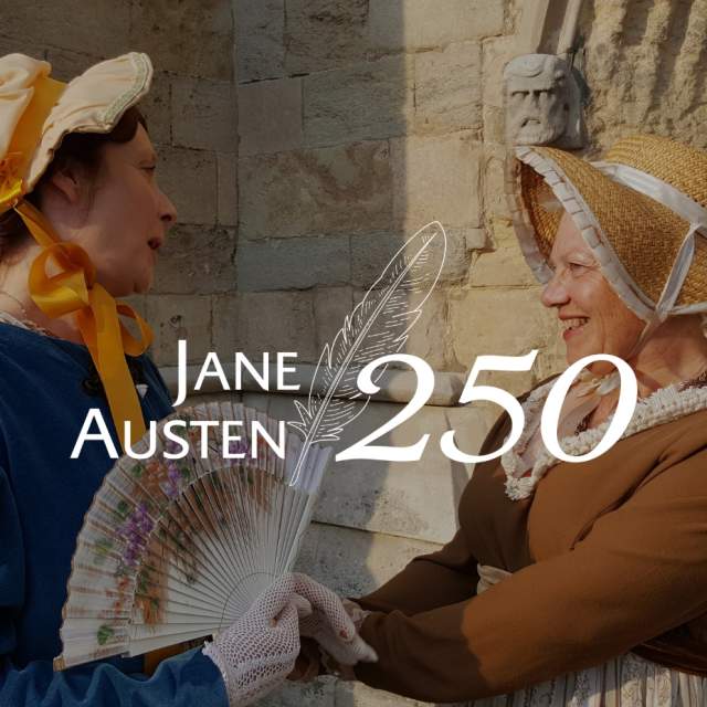 Two women dressed in period pieces in celebration of Jane Austen 250