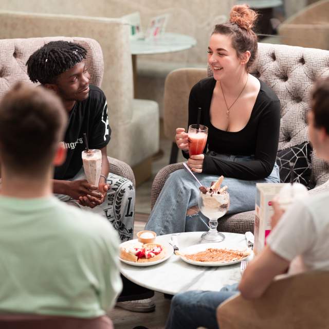 Group of friends enjoying desserts at Sprinkles Gelato