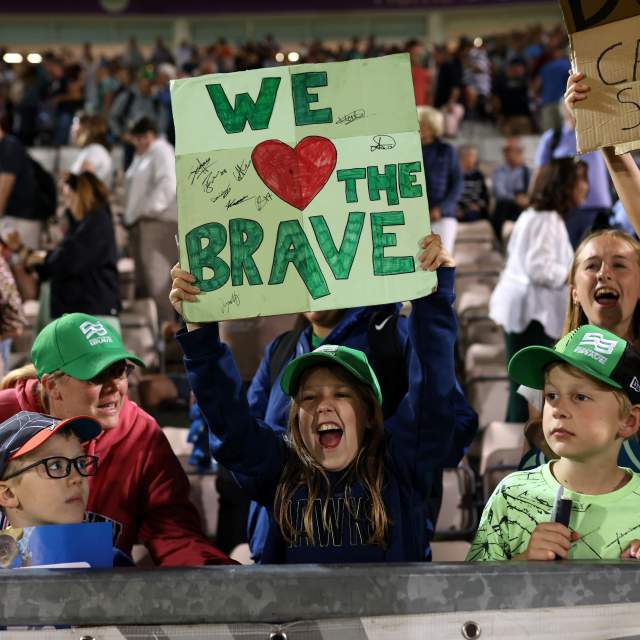 Group of Southern Brave Fans cheering on team at The Hundred