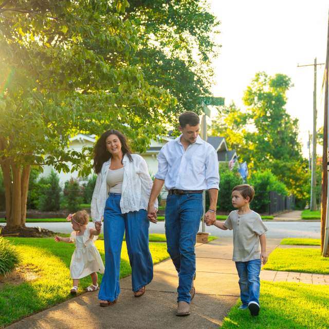 Family walking thru neighborhood