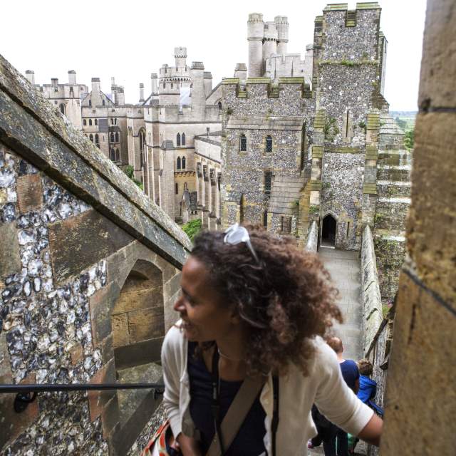 Lady walking up the stairs outside Arundel Castle