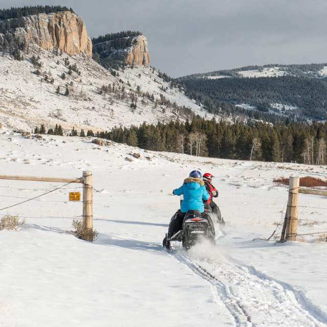 Snowmobile navigating a snowy trail in the Bighorn Mountains, Sheridan County, Wyoming.