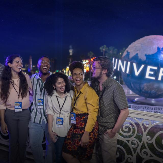 Group for meeting at Universal Orlando Resort by globe at night