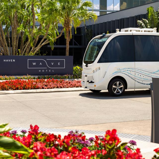 Lake Nona Wave Hotel beep shuttle outside hotel