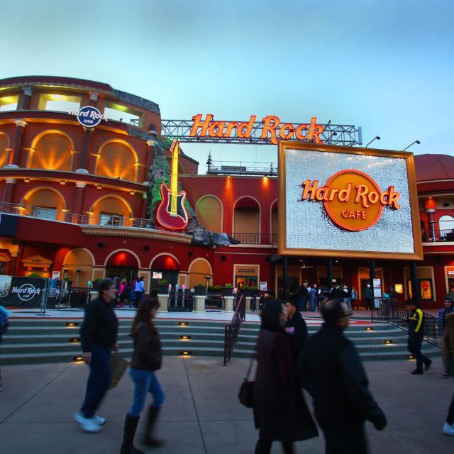 Hard Rock Cafe & Live entrance, with a crowd passing by.