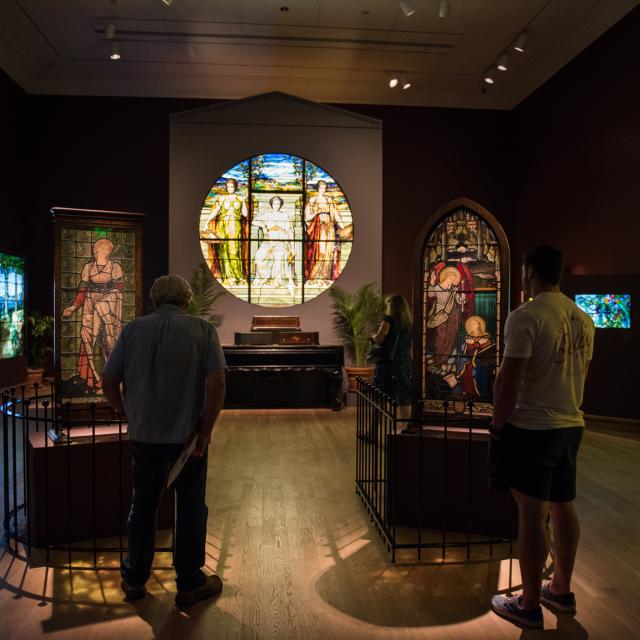Guests exploring an exhibit inside The Charles Hosmer Morse Museum of American Art