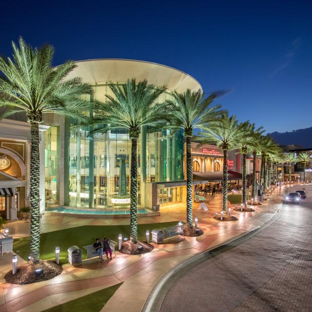 The main entrance to the Mall at Millenia in Orlando at night