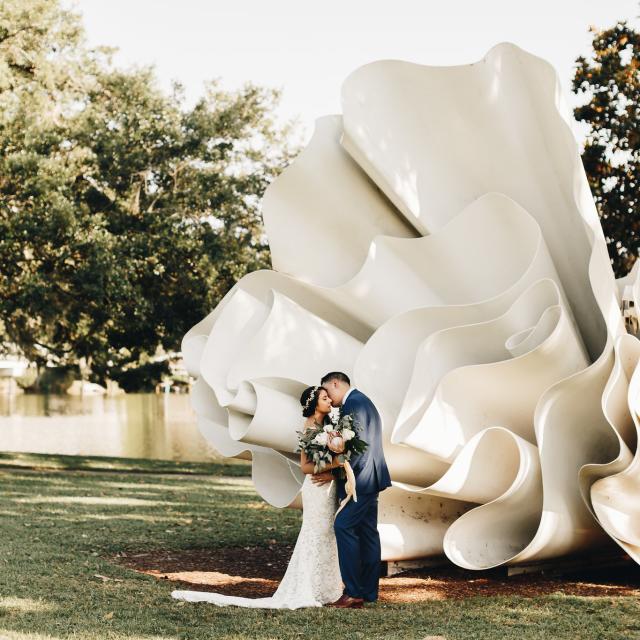 A couple posed for a wedding photo at The Mennello Museum of American Art.