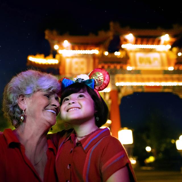A woman and child smiling at Epcot