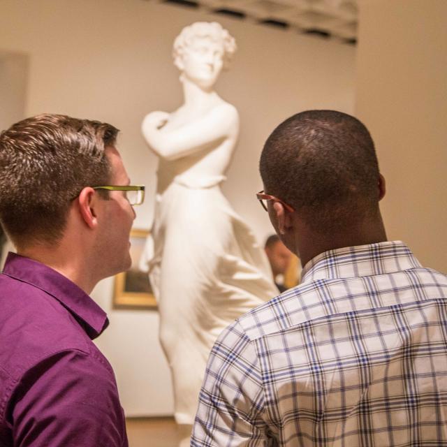 Orlando Museum of Art two men looking at a sculpture