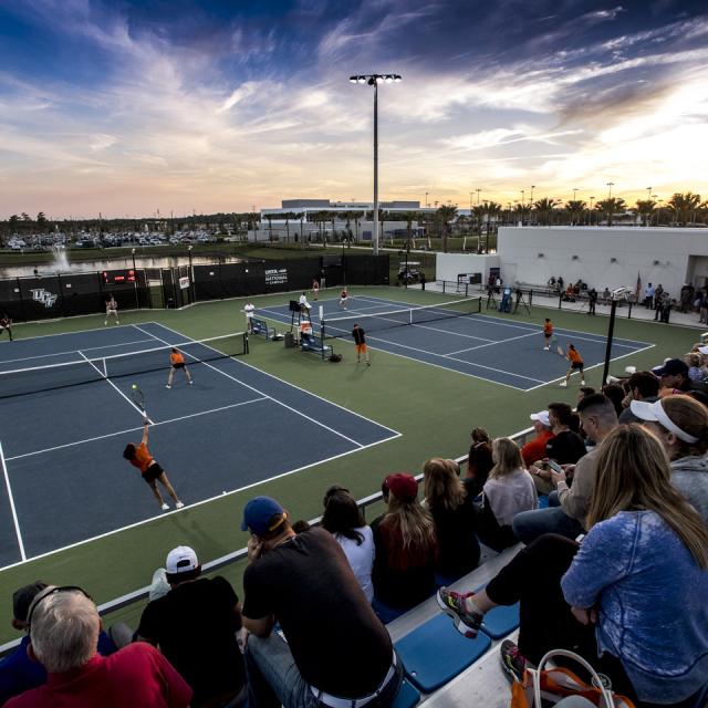 A crowd watches a tennis match at USTA National Campus Collegiate Center.