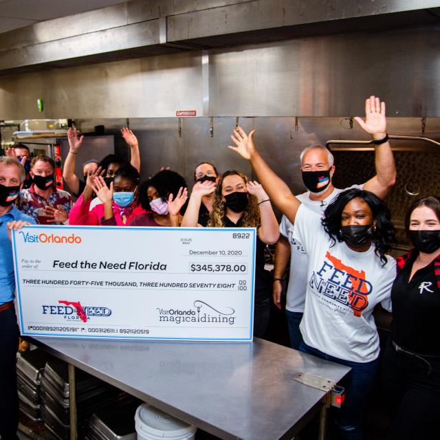 2020 Magical Dining check presentation to Feed the Need charity