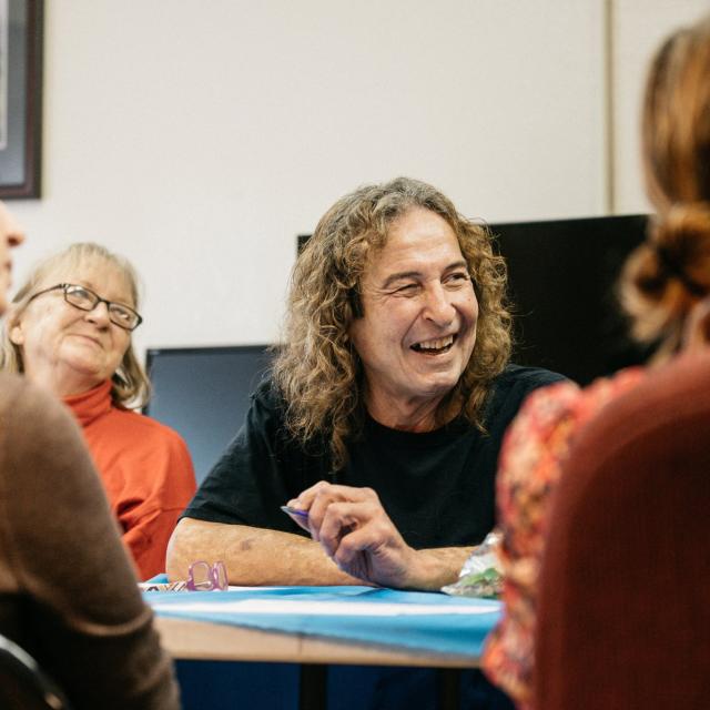 A group of people having a meeting at Pathlight HOME