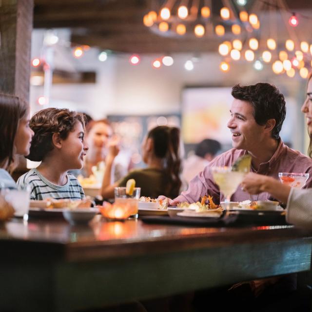 A family of four dining at Uncle Julio's at ICON Park