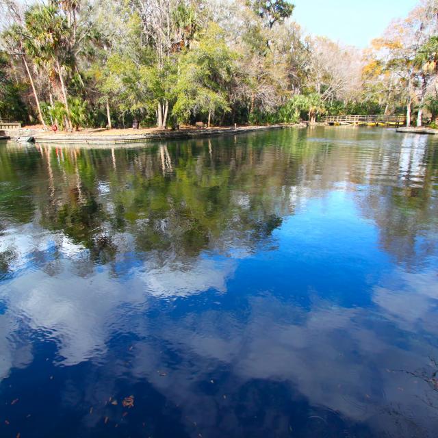 Clouds reflect off the waters of Wekiwa Springs State Park in central Florida.