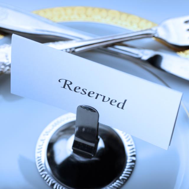 Reserved seating for a formal dinner.