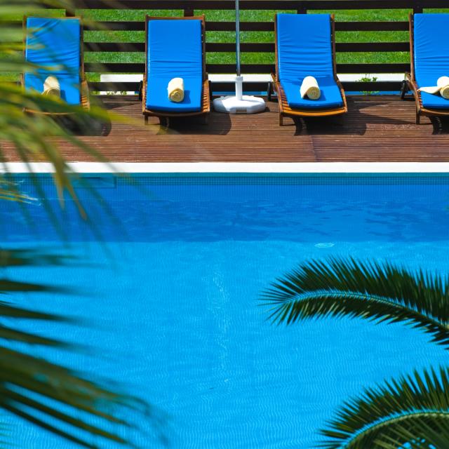 lounge chairs by a swimming pool