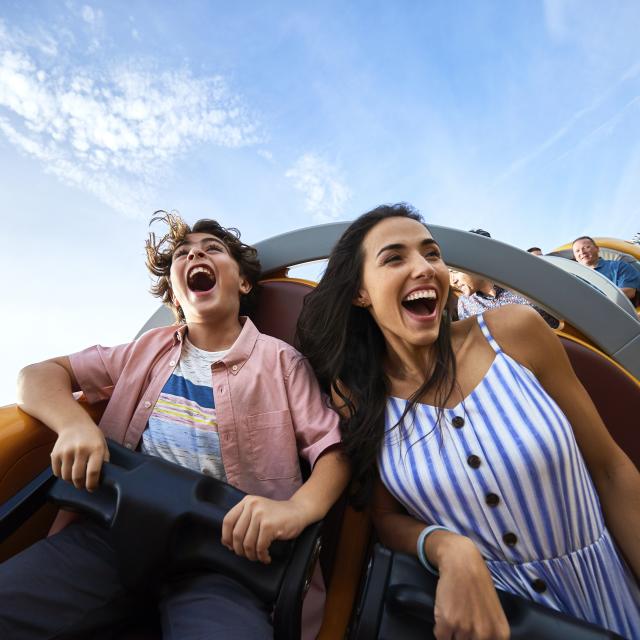 A mother and son on the Slinky Dog Dash rollercoaster in Toy Story Land at the Magic Kingdom in the Walt Disney World Resort