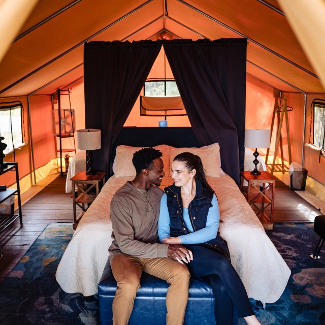 A couple enjoying their glamping trip