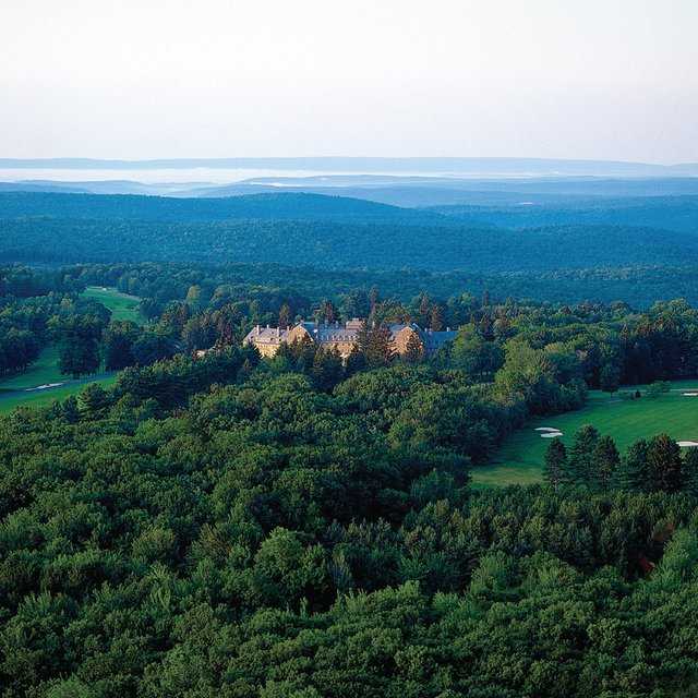 Aerial view overlooking a resort with green surrounding it.