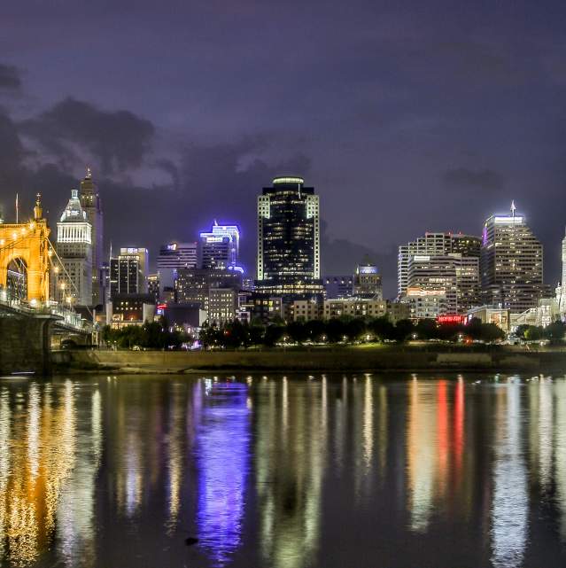 nighttime skyline shot of cincinnati roebling bridge