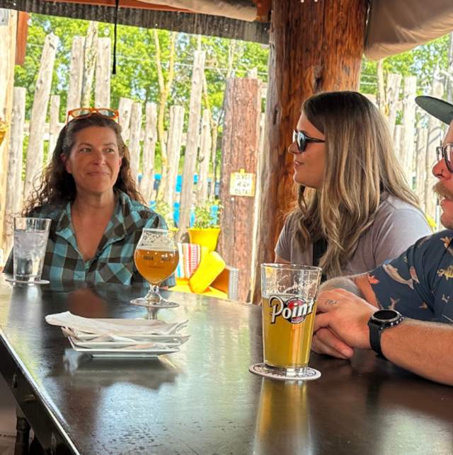 Friends drinking a beer at Sconni's