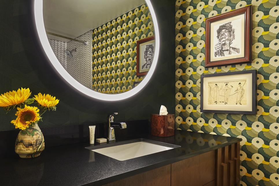 A hotel bathroom with bright duck wallpaper