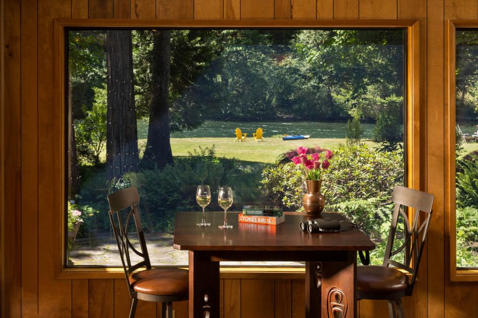The river is seen through a window from the lodge's common room.