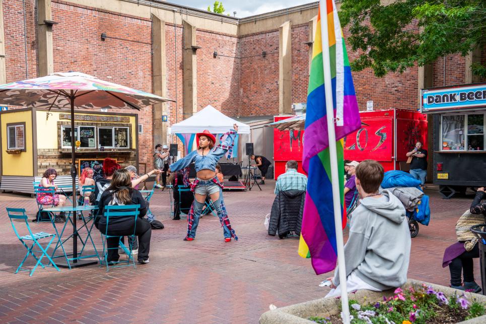 Kesey square has food carts, entertainment and pride flag.