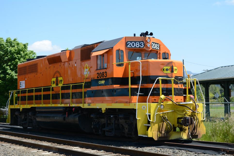 Orange train on tracks