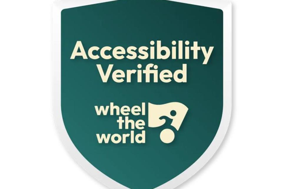 A bade that says Accessibility Verified Wheel the World with their logo.