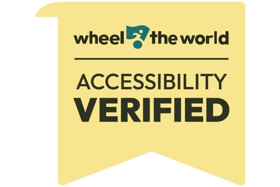 A yellow badge that says Wheel the World Accessibility Verified.